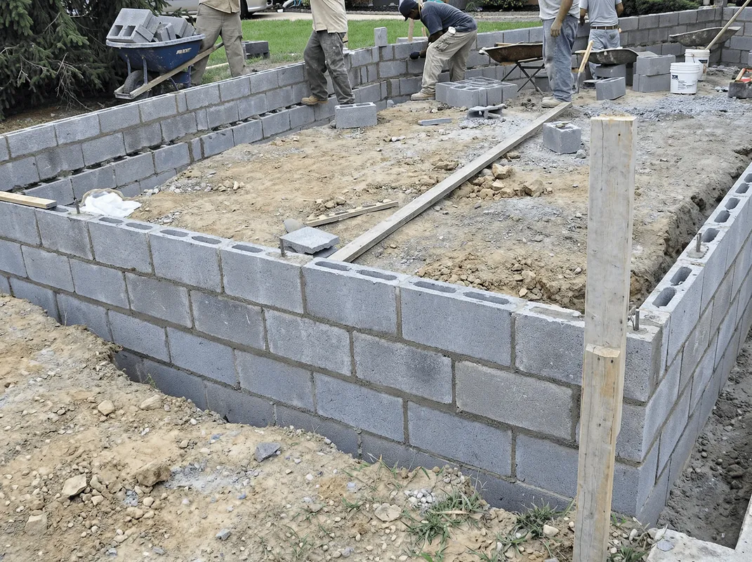 Professionals building a foundation with blocks in Long Beach, CA