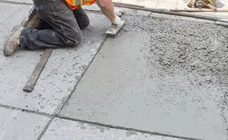 Professional repairing a concrete floor in Long Beach, CA