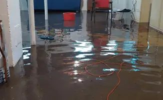 Basement with boiler, cabinets and washing machine completely flooded in Long Beach, CA