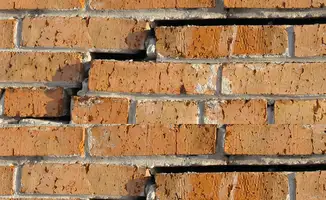Brick wall with serious structural damage in Long Beach, CA